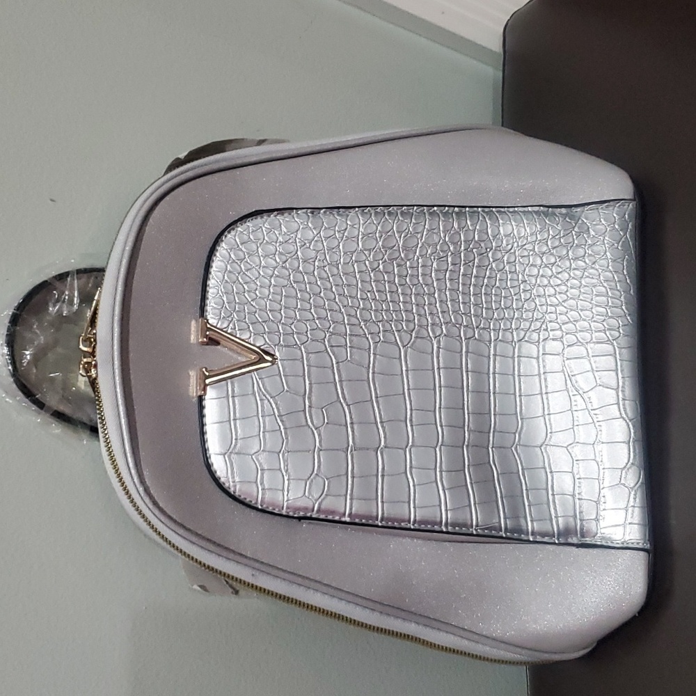 Brand new silver mini backpack